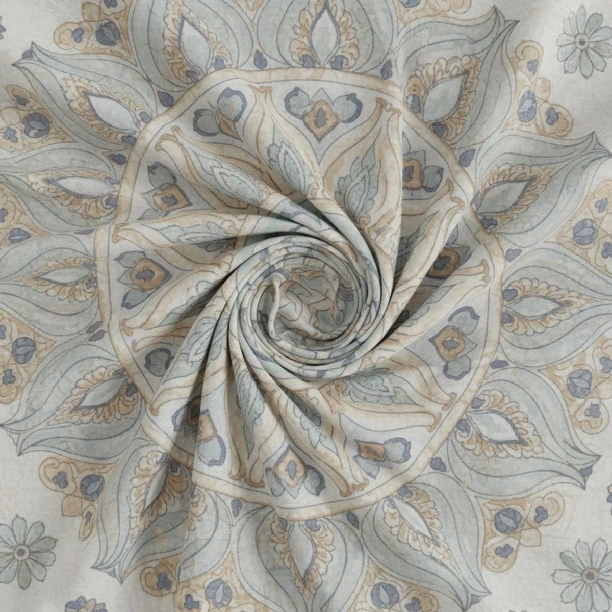 Close-up of soft printed bedsheet fabric with paisley and floral motifs