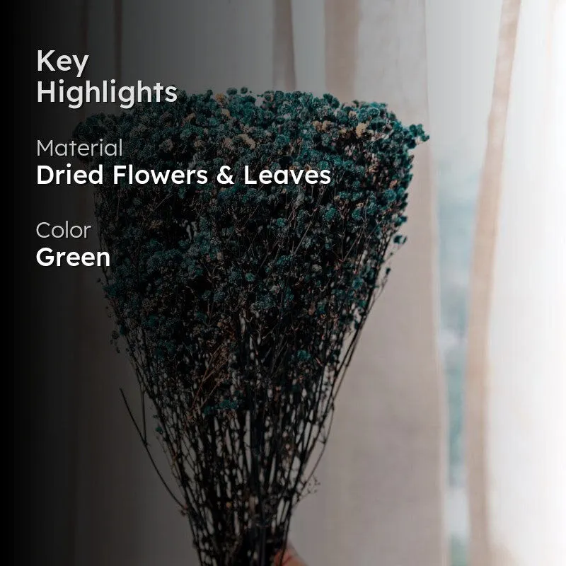 Blue dried flower bouquet displayed against a softly lit curtain backdrop.