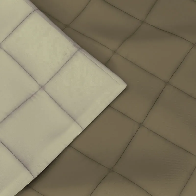 Close-up of the comforter's soft olive-brown quilted surface and seams
