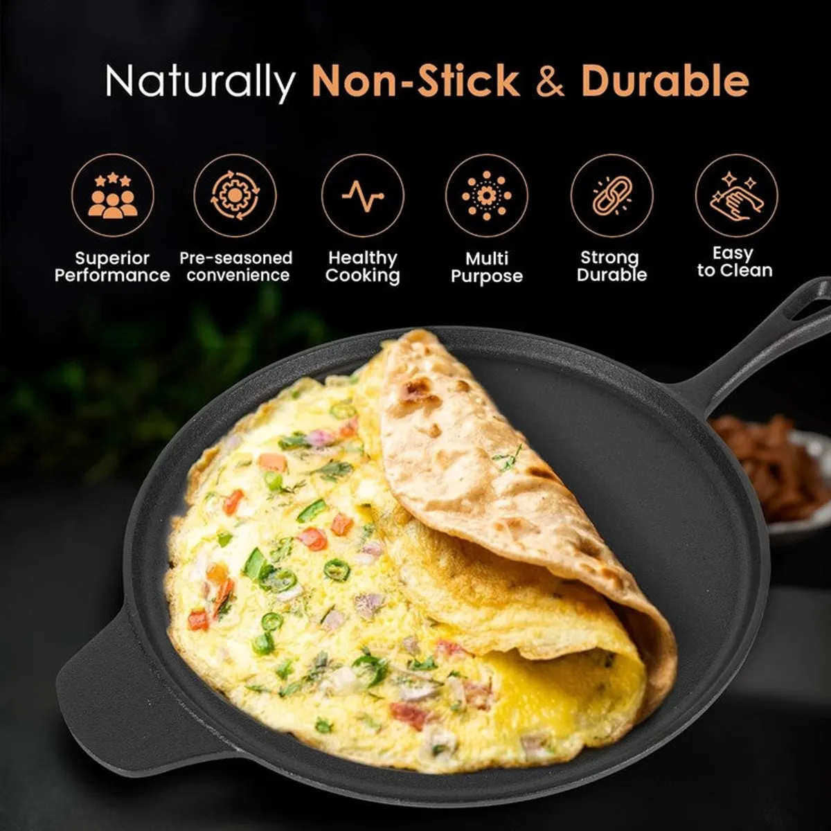 Black cast iron dosa tawa with omelette and flatbread