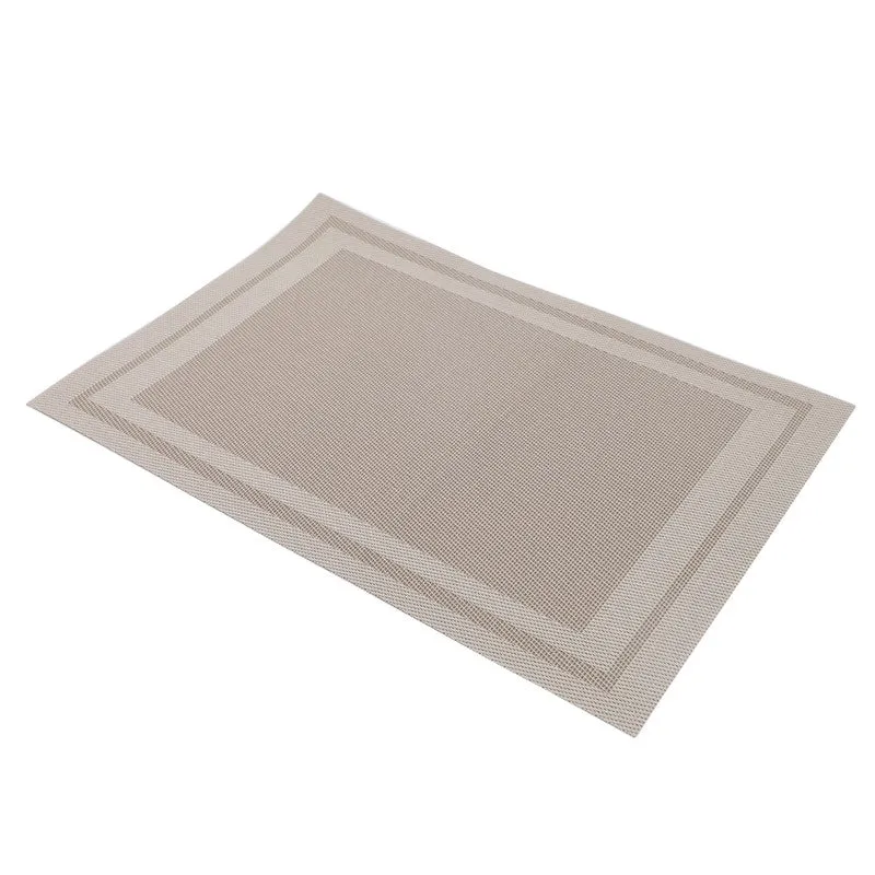 Angled view of a brown rectangular table mat with a fine textured surface