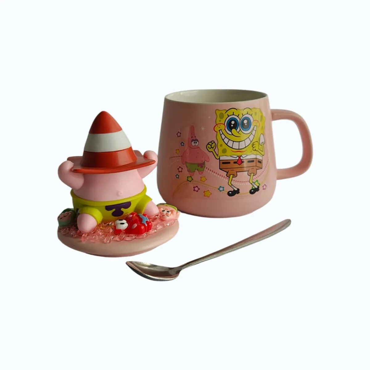 Pink cartoon mug, character lid and spoon shown together