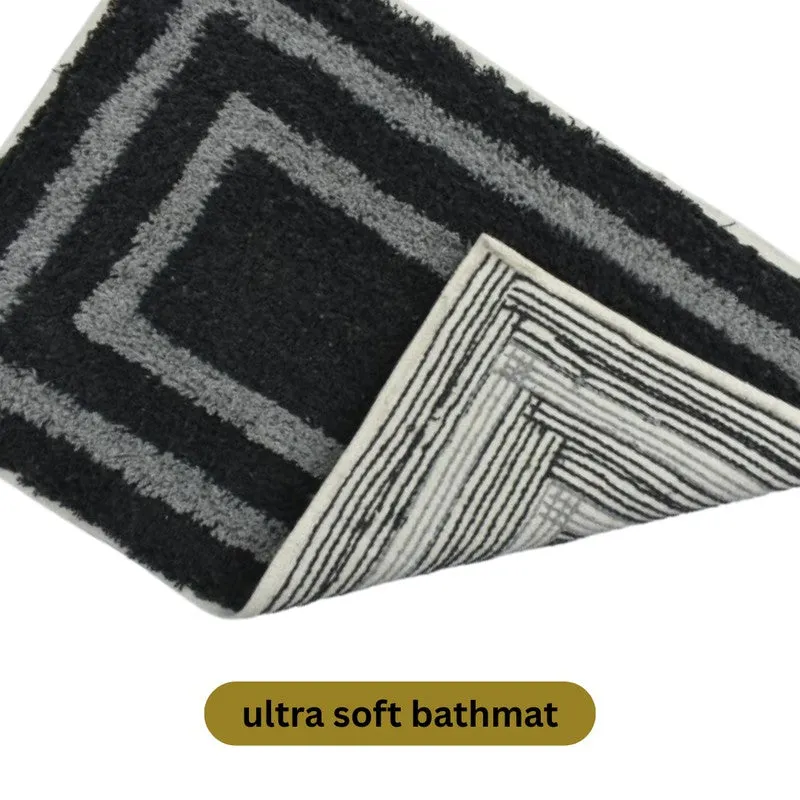 Blue and white bath mat folded to show its striped canvas backing