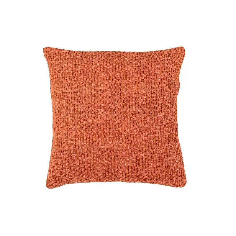 Front view of an orange square textured cushion cover