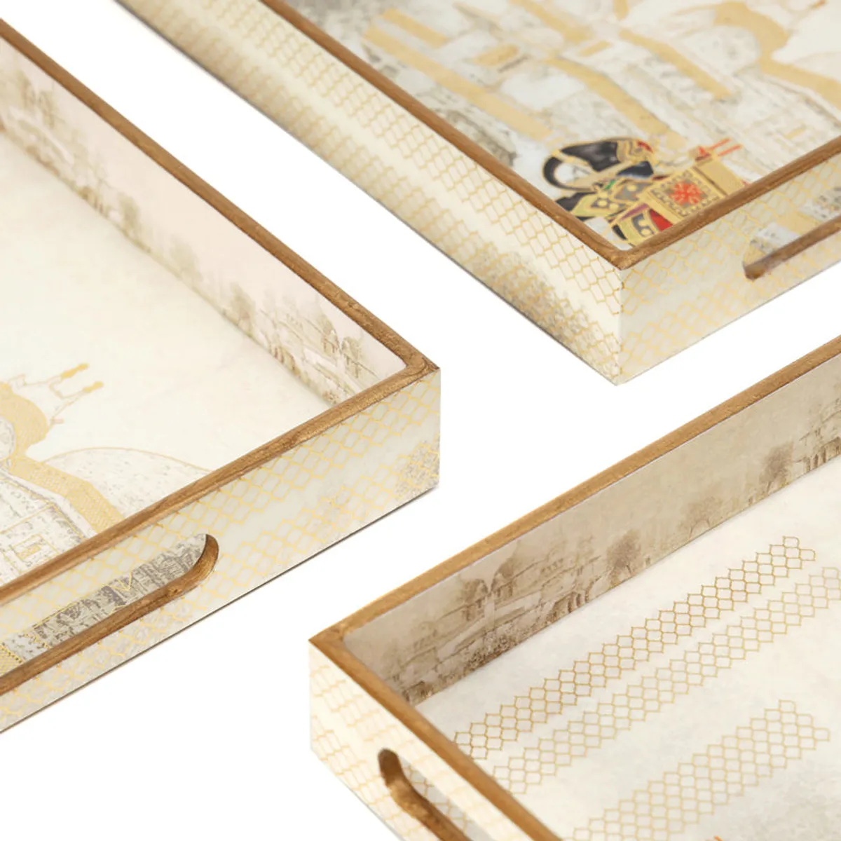 Close-up of ivory serving trays with geometric side detailing and elephant motifs