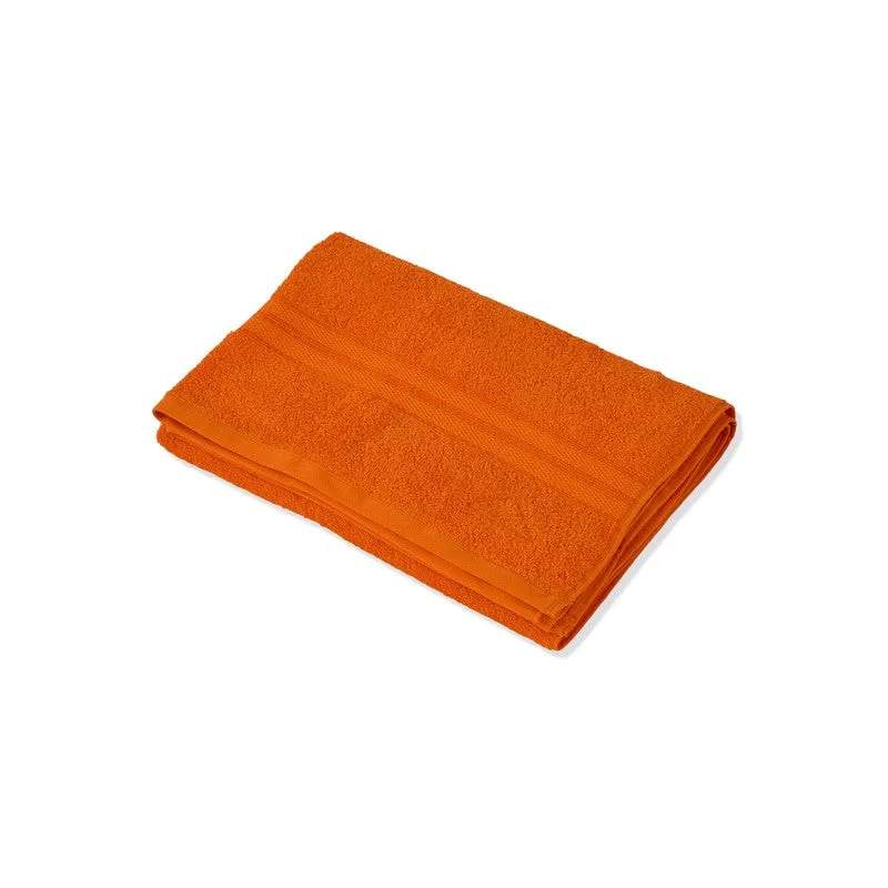 Folded orange bath towel shown against a white background