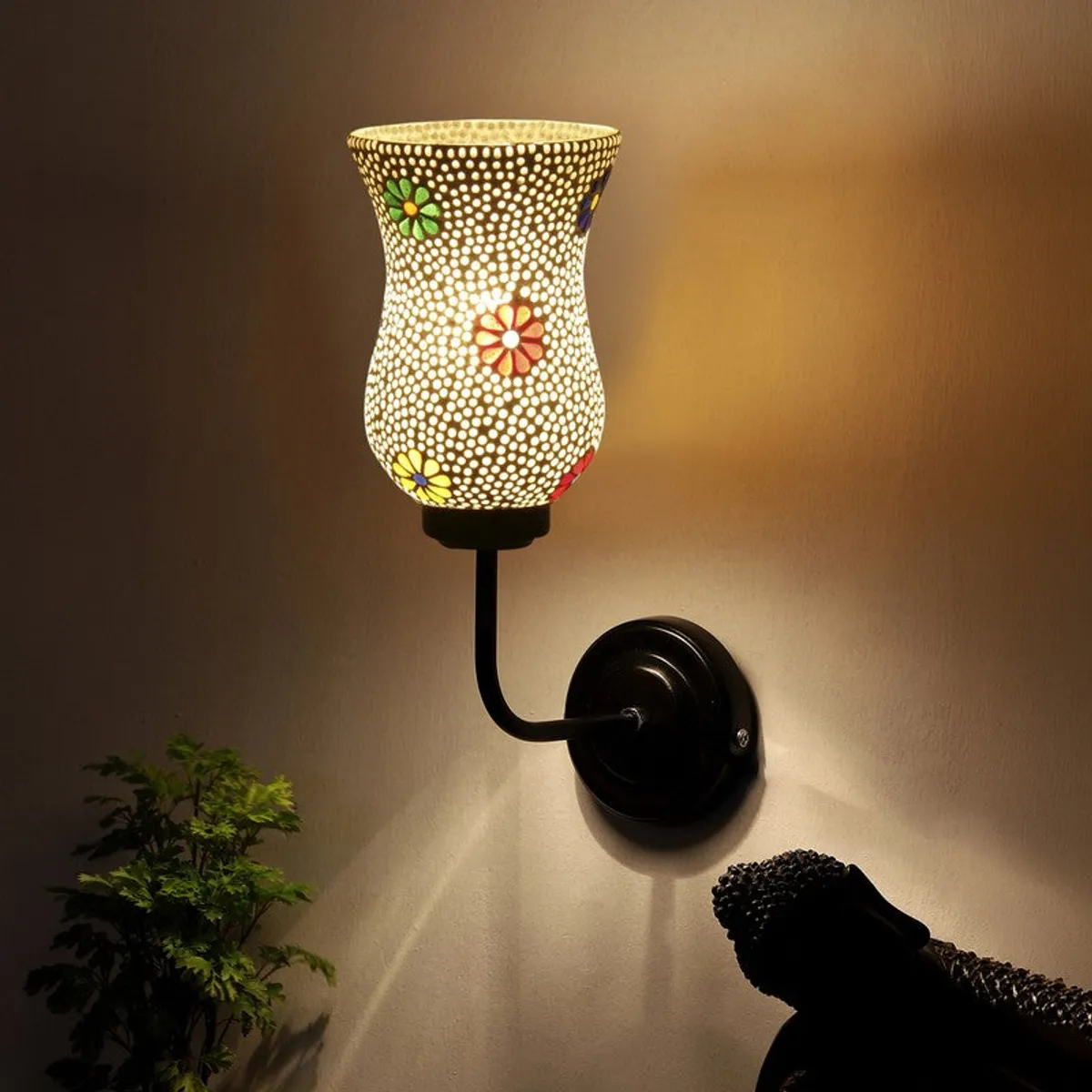 Glowing white mosaic wall lamp casting warm light on the wall