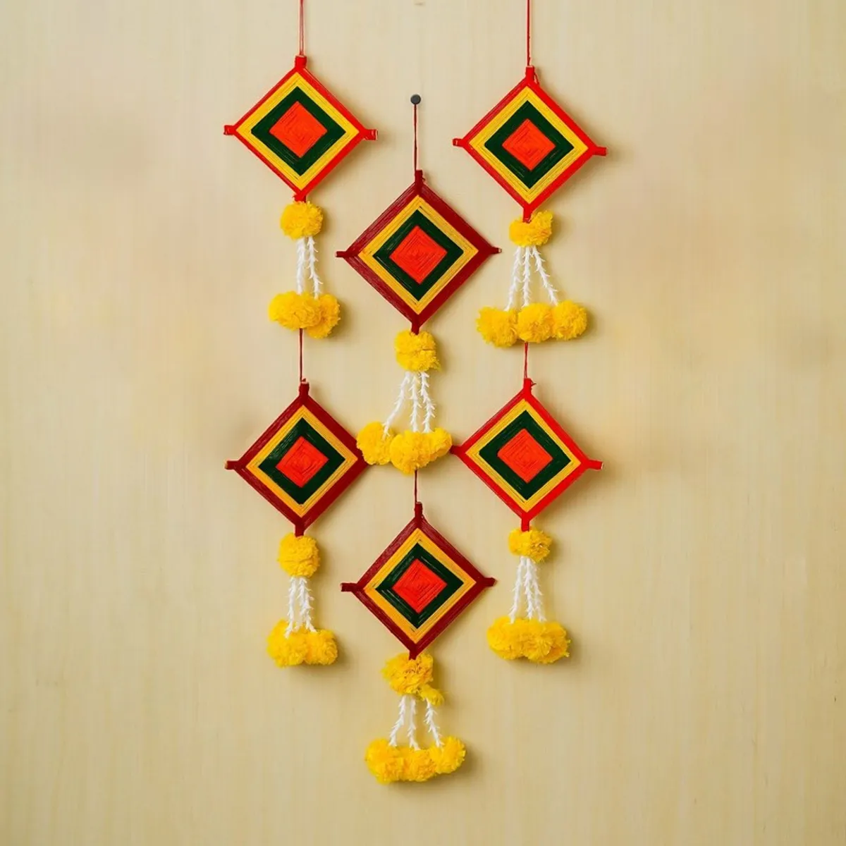 Set of six multicolour square fabric latkans with yellow tassel accents