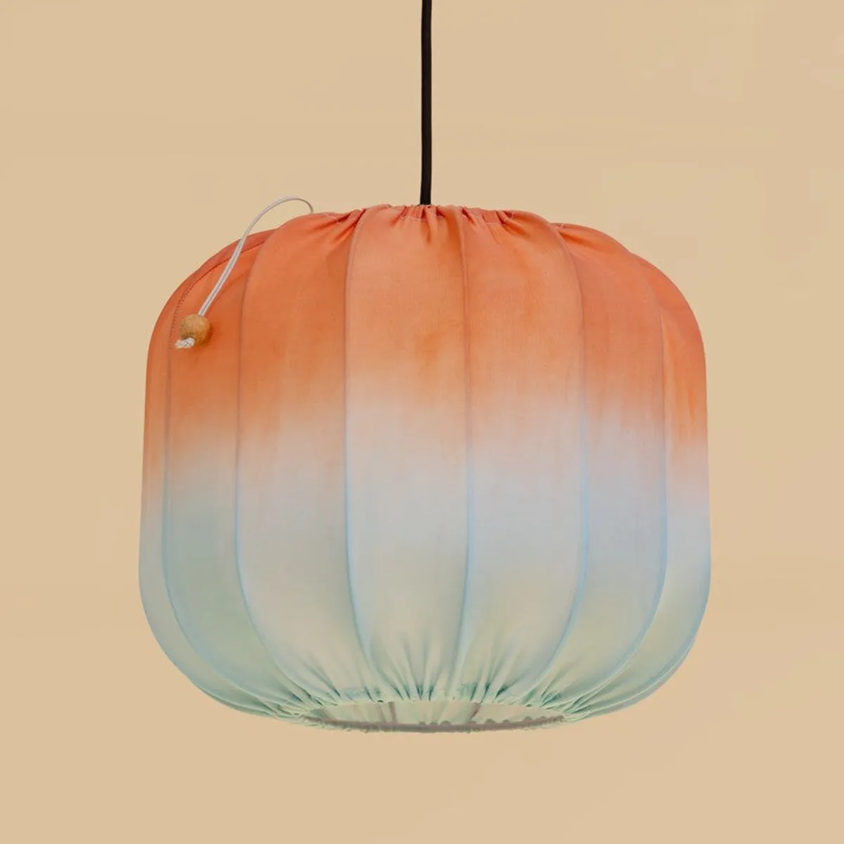 Close view of the rounded ombré pendant shade with vertical ribs