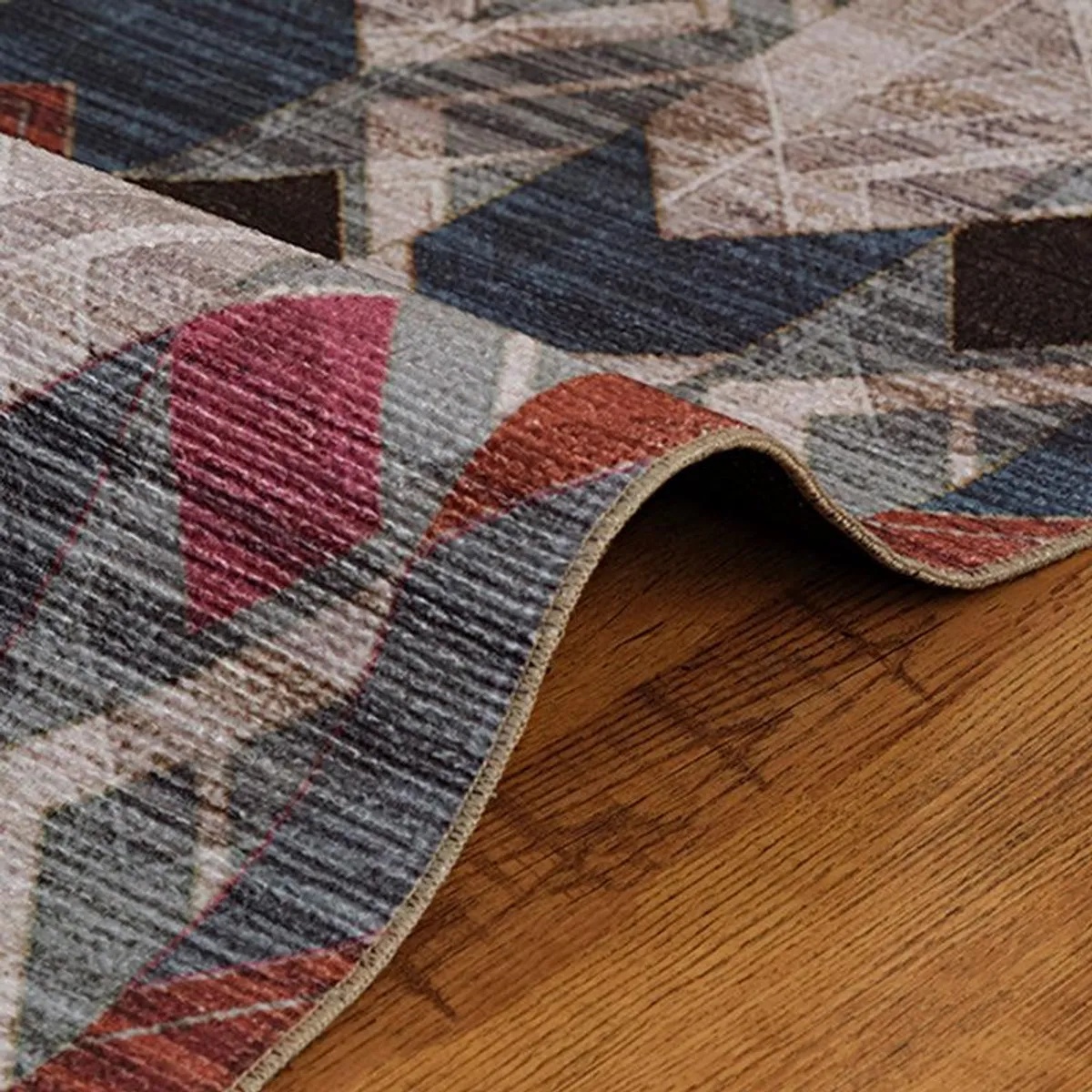 Close-up of the carpet edge showing the geometric pattern and flat surface