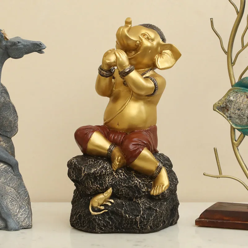 Playful Vinayaka Polyresin Showpiece - Gold & Black media 1