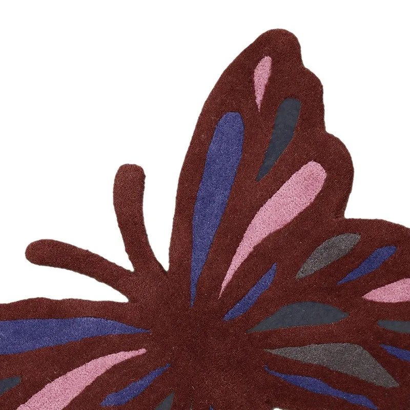 Close-up of textured maroon, pink, blue and charcoal butterfly carpet