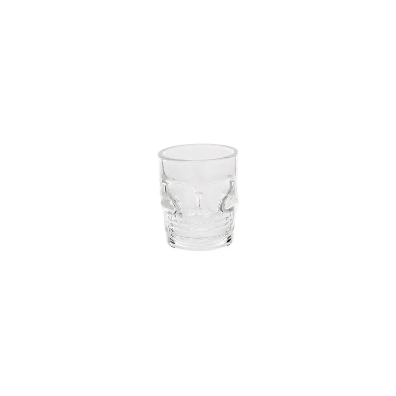 Single clear skull-shaped shot glass on a white background