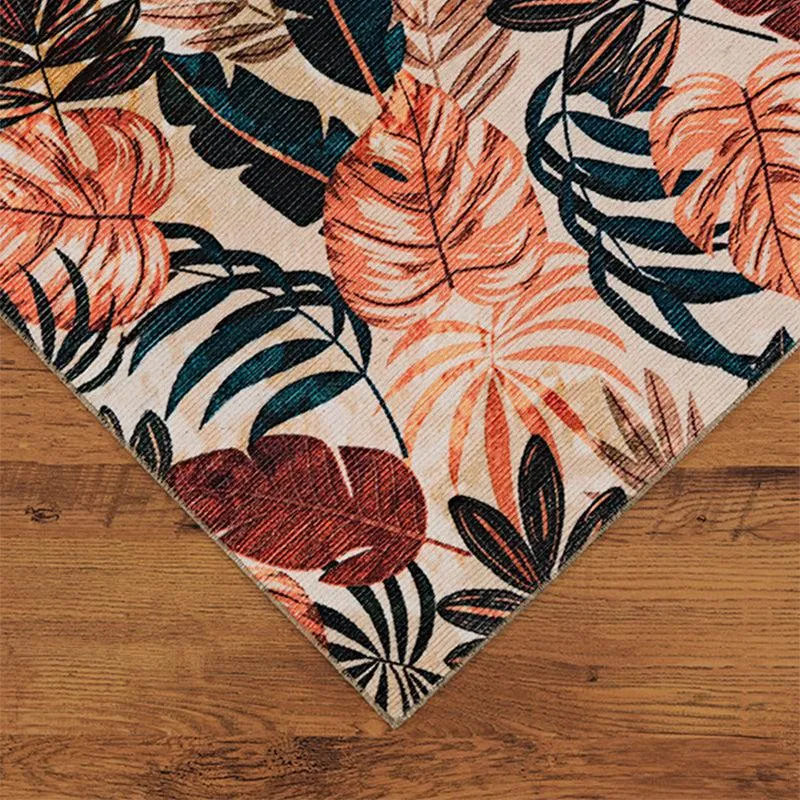 Corner view of the carpet showing tropical leaf pattern and flat surface
