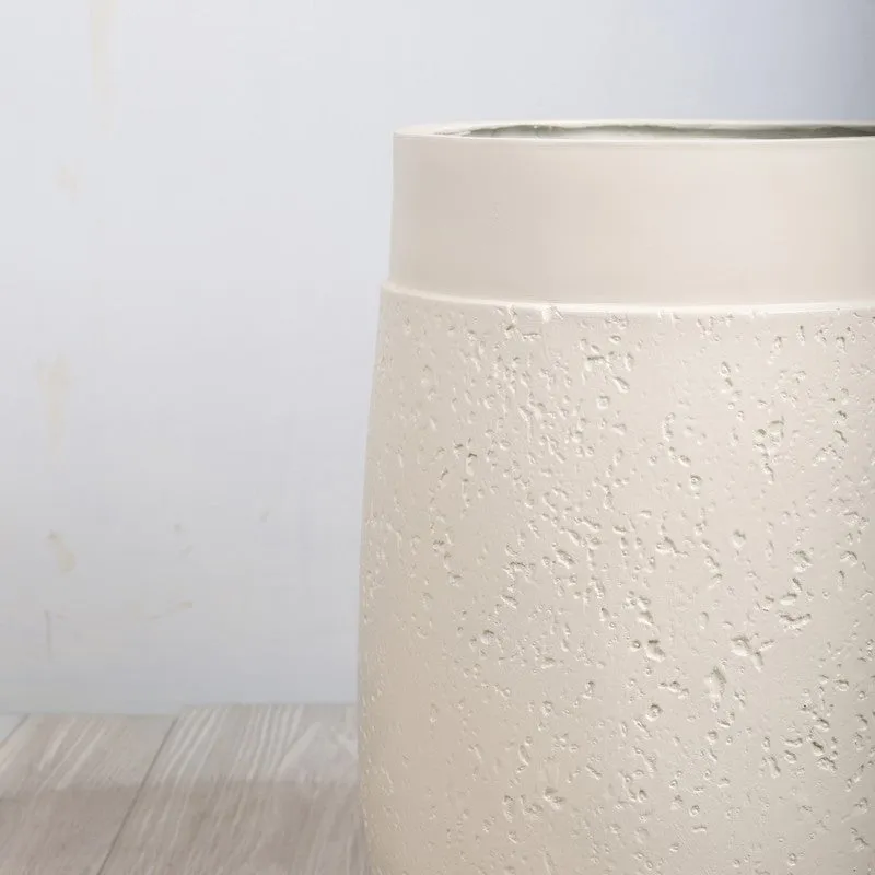 Close-up of the white planter's textured surface and smooth rim