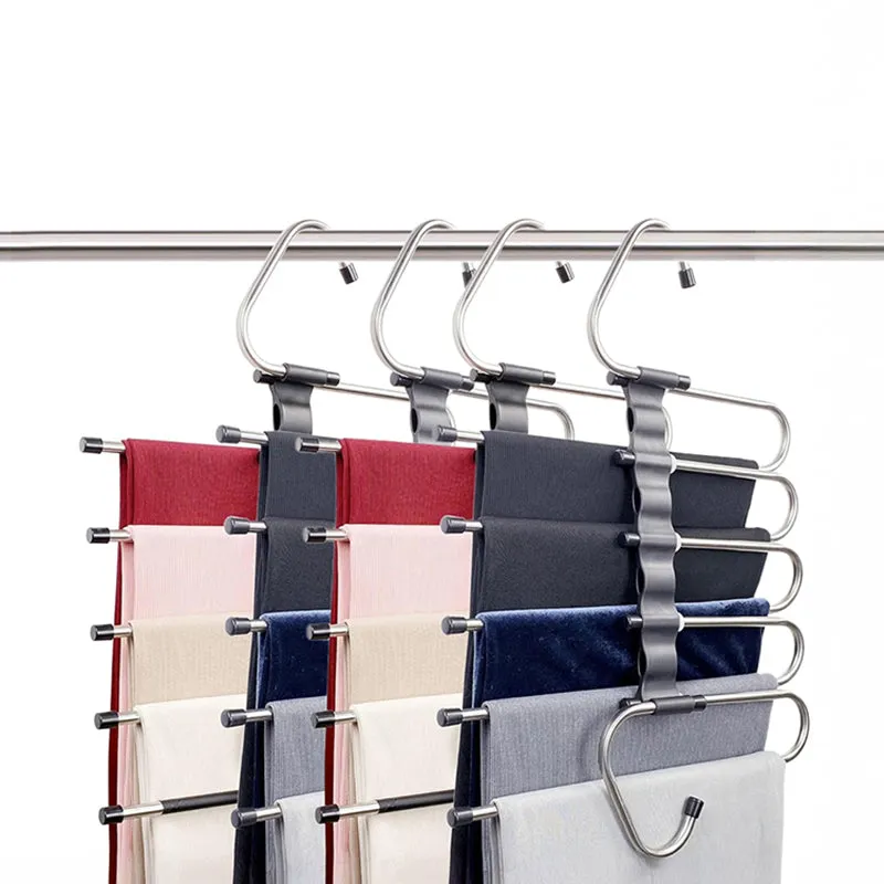 Four stainless steel multi-level hangers with black grips holding folded garments against a white background