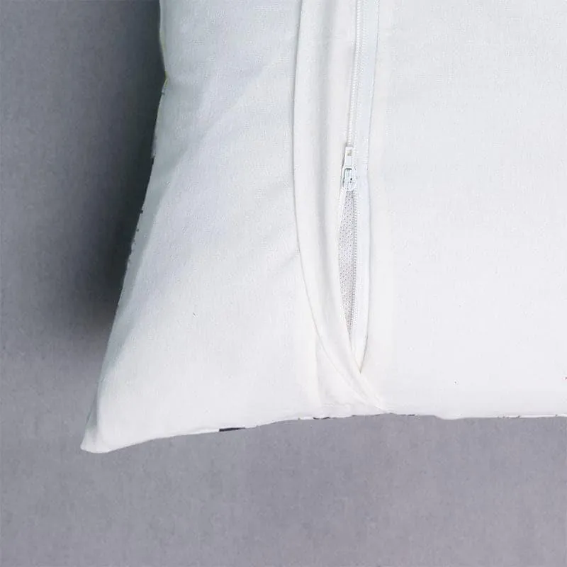 Close-up of the white reverse side showing the cushion cover's zip closure.