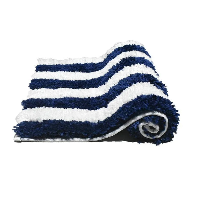 Rolled blue and white striped bath mat showing its plush texture