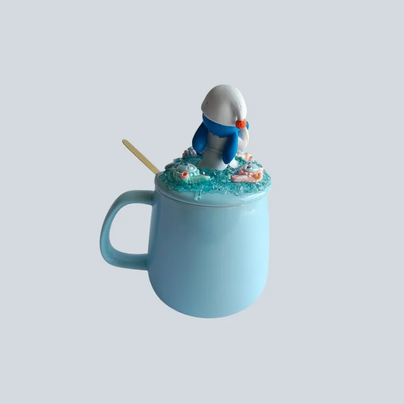 Side view of blue ceramic mug with sculpted Stitch lid and spoon