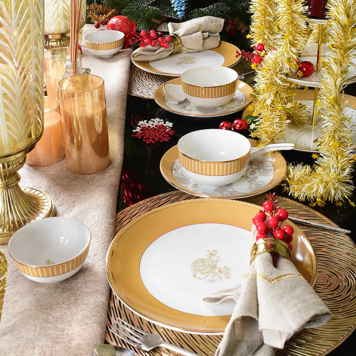 Festive dining table styled with mustard and gold porcelain dinnerware