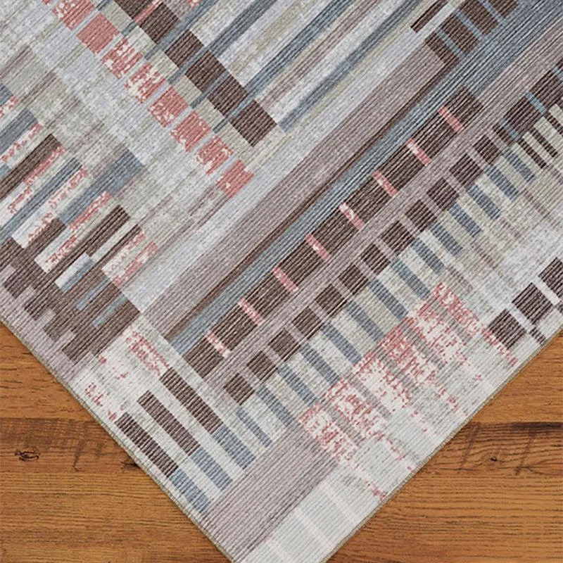 Close-up of the carpet corner showing abstract linear pattern