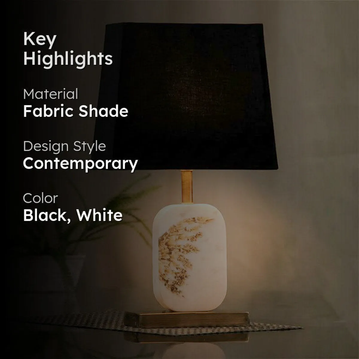Black and white contemporary table lamp with brass-toned details