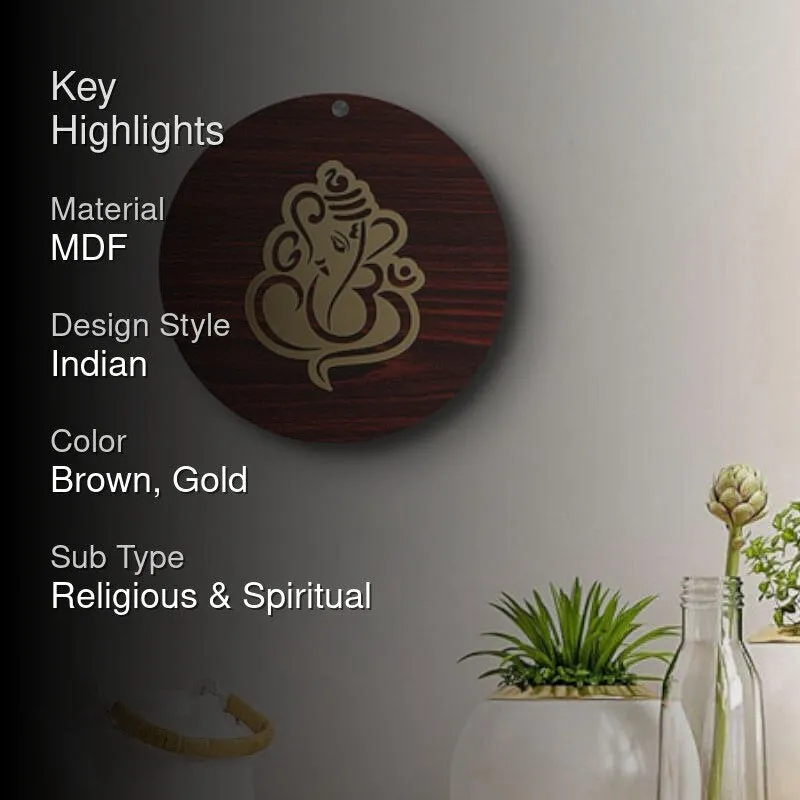 Brown and gold Ganesha wall accent styled on a light wall with plants