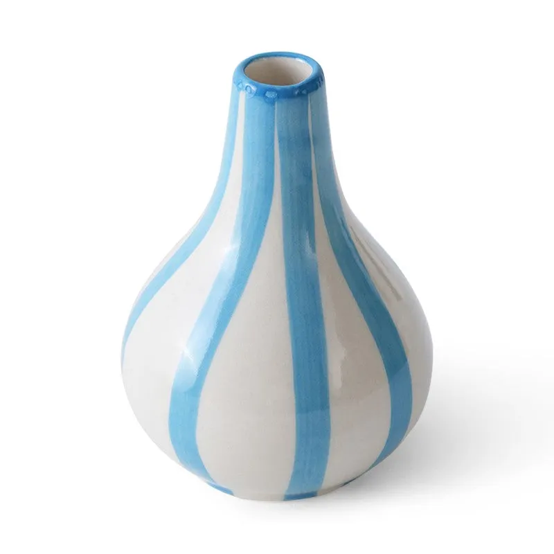 Angled view of a white ceramic vase with blue stripes on a white background