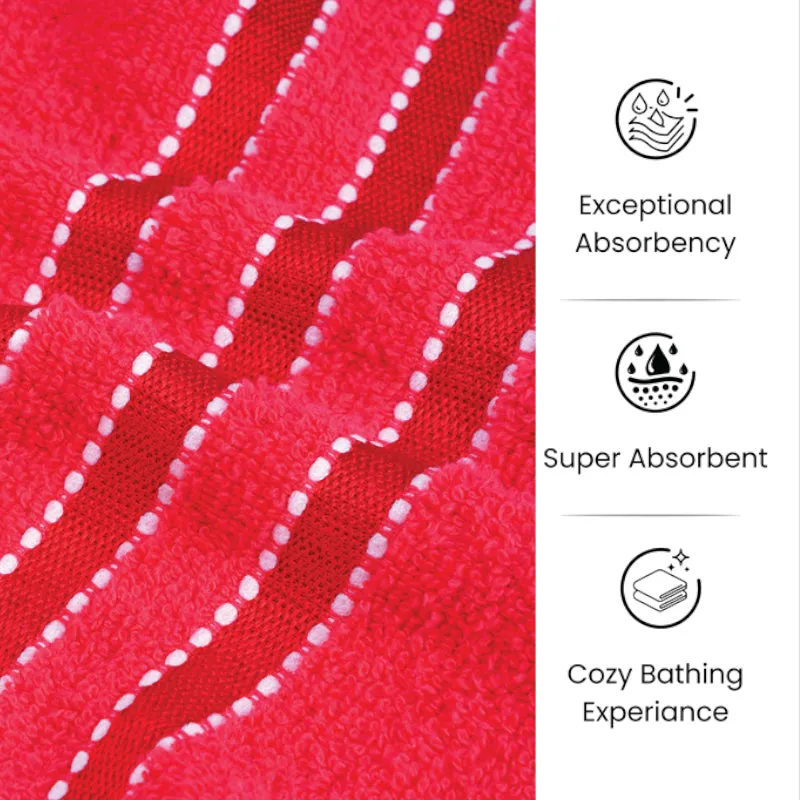 Red towel hanging in a bathroom with a striped lower border