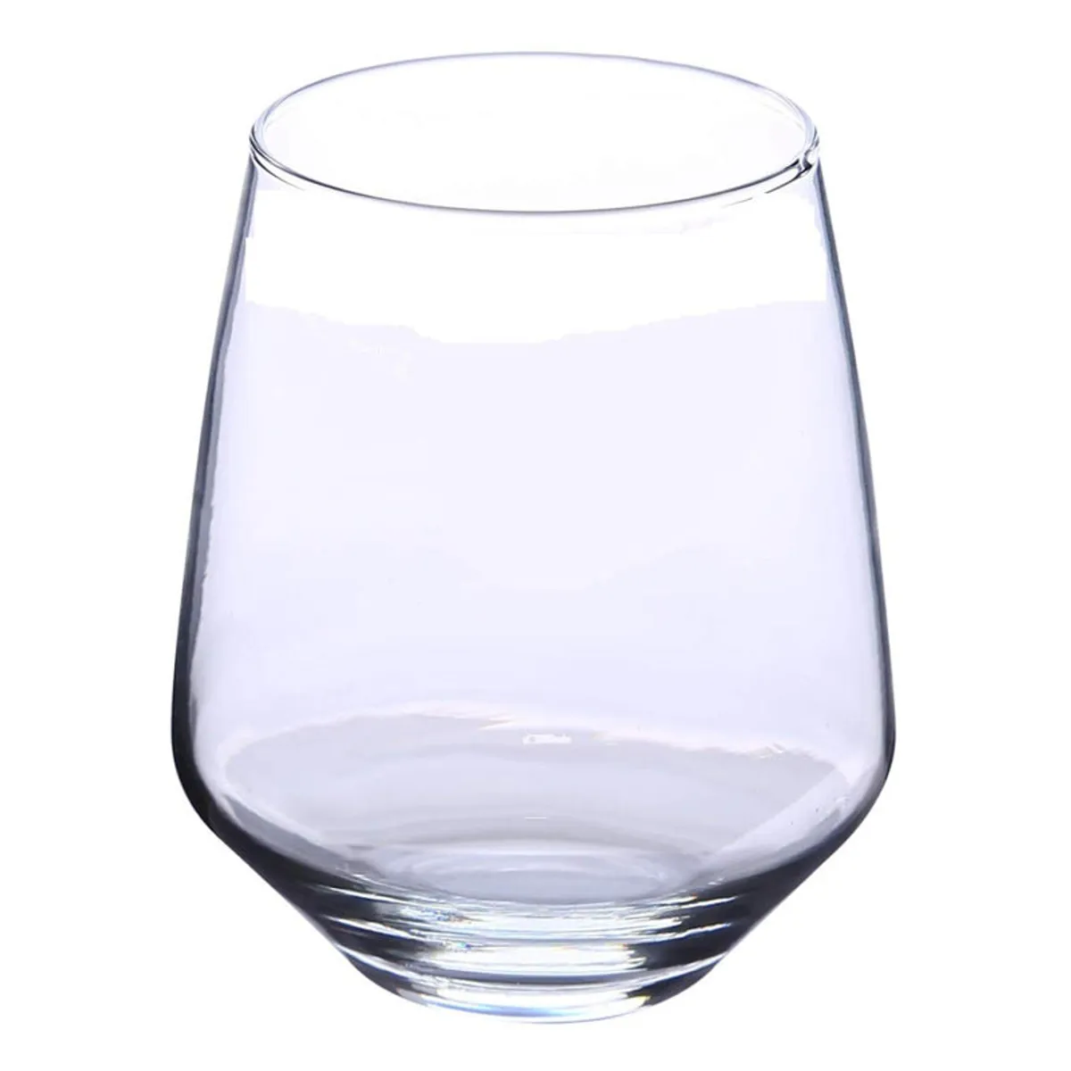 Empty transparent whiskey glass with a rounded tapered shape