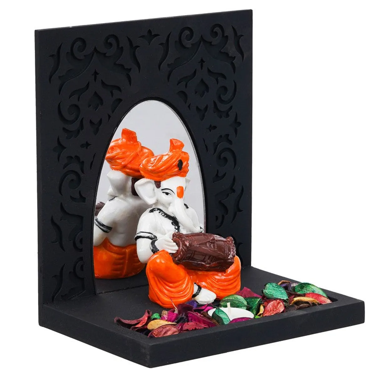 Angled view of black candle holder with orange and white Ganesha figurine