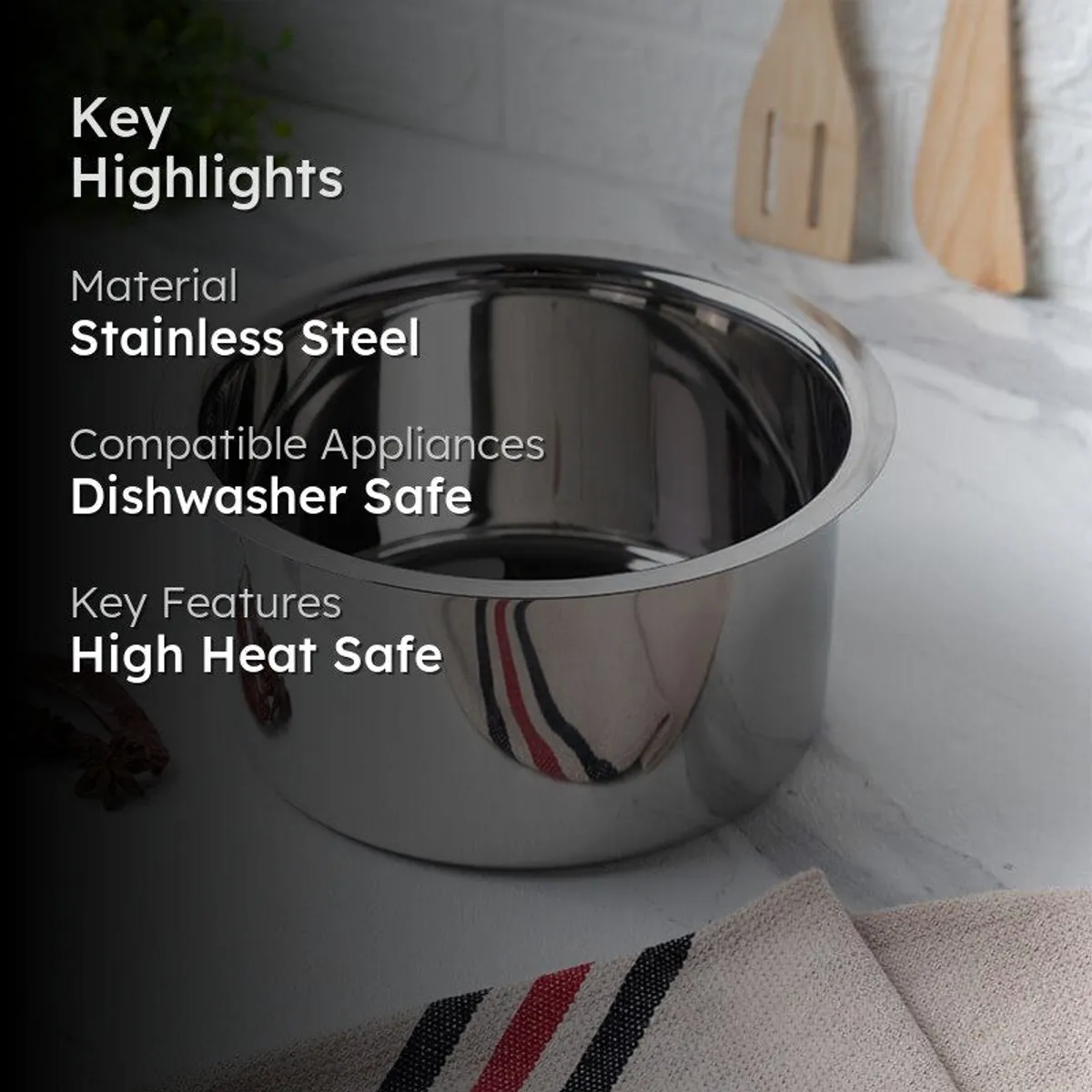 Glossy stainless steel cookware arranged against a warm neutral background