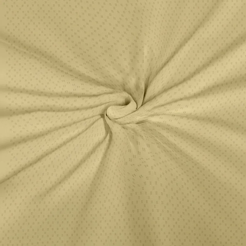 Close-up of pale yellow fabric with tiny dotted pattern