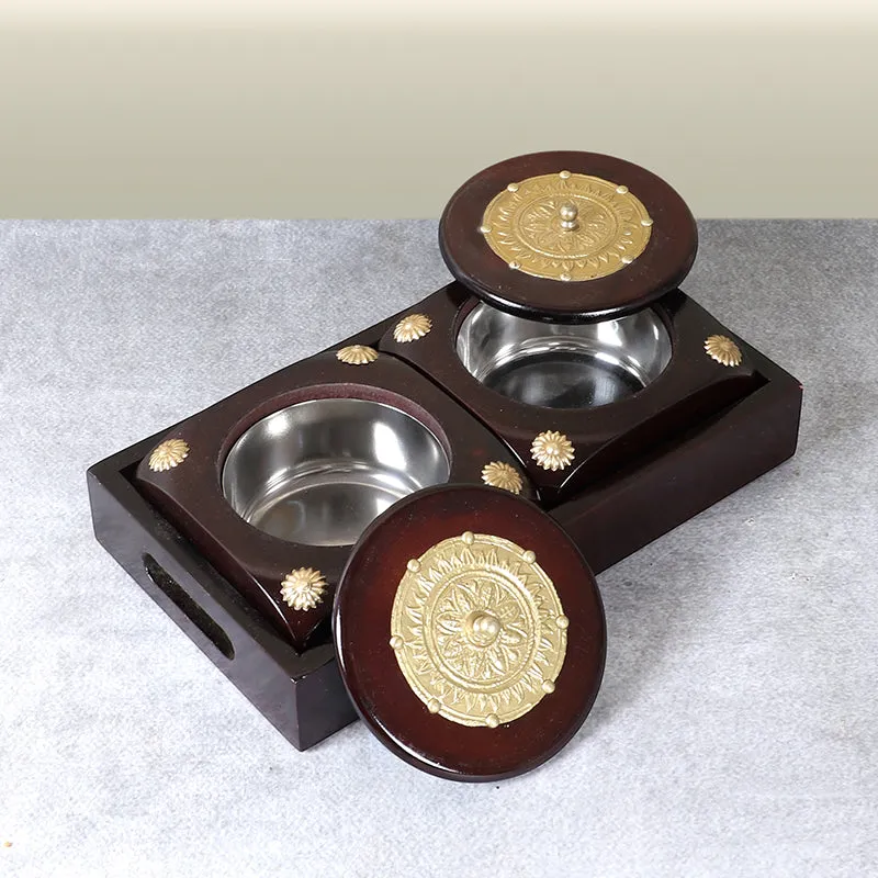 Open brown container showing two metal-lined compartments and detached lids
