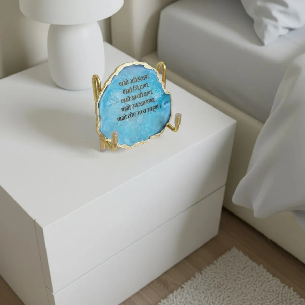 Blue agate religious accent styled on a white bedside table