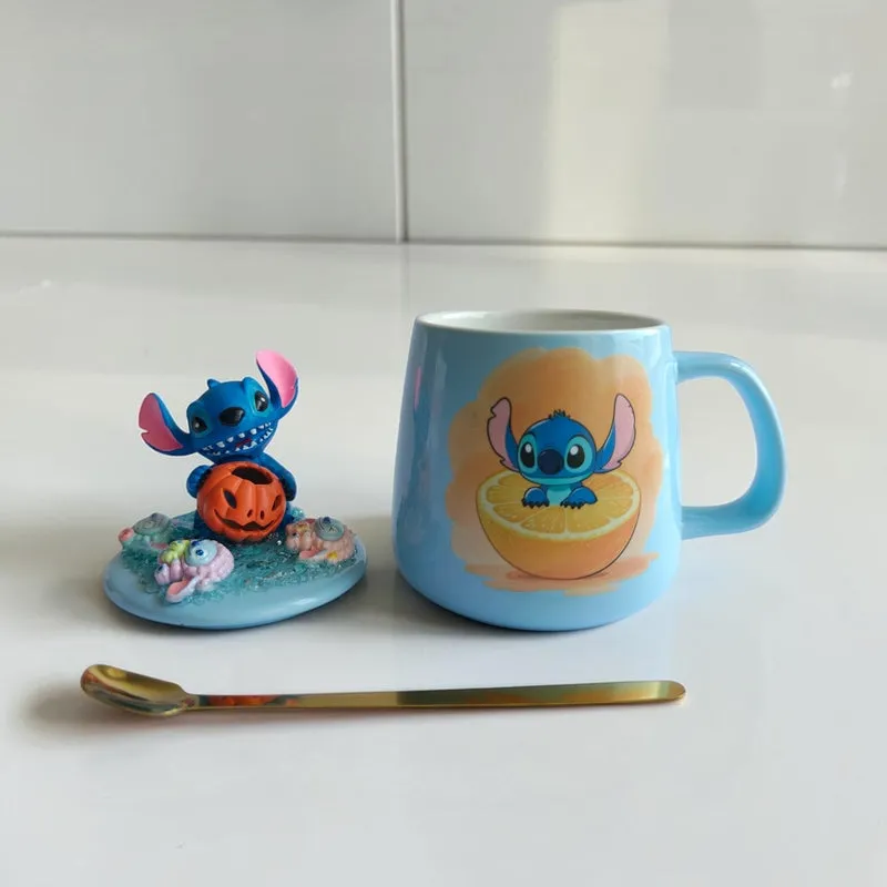 Light blue ceramic Stitch mug with matching figurine lid and spoon against a white backdrop