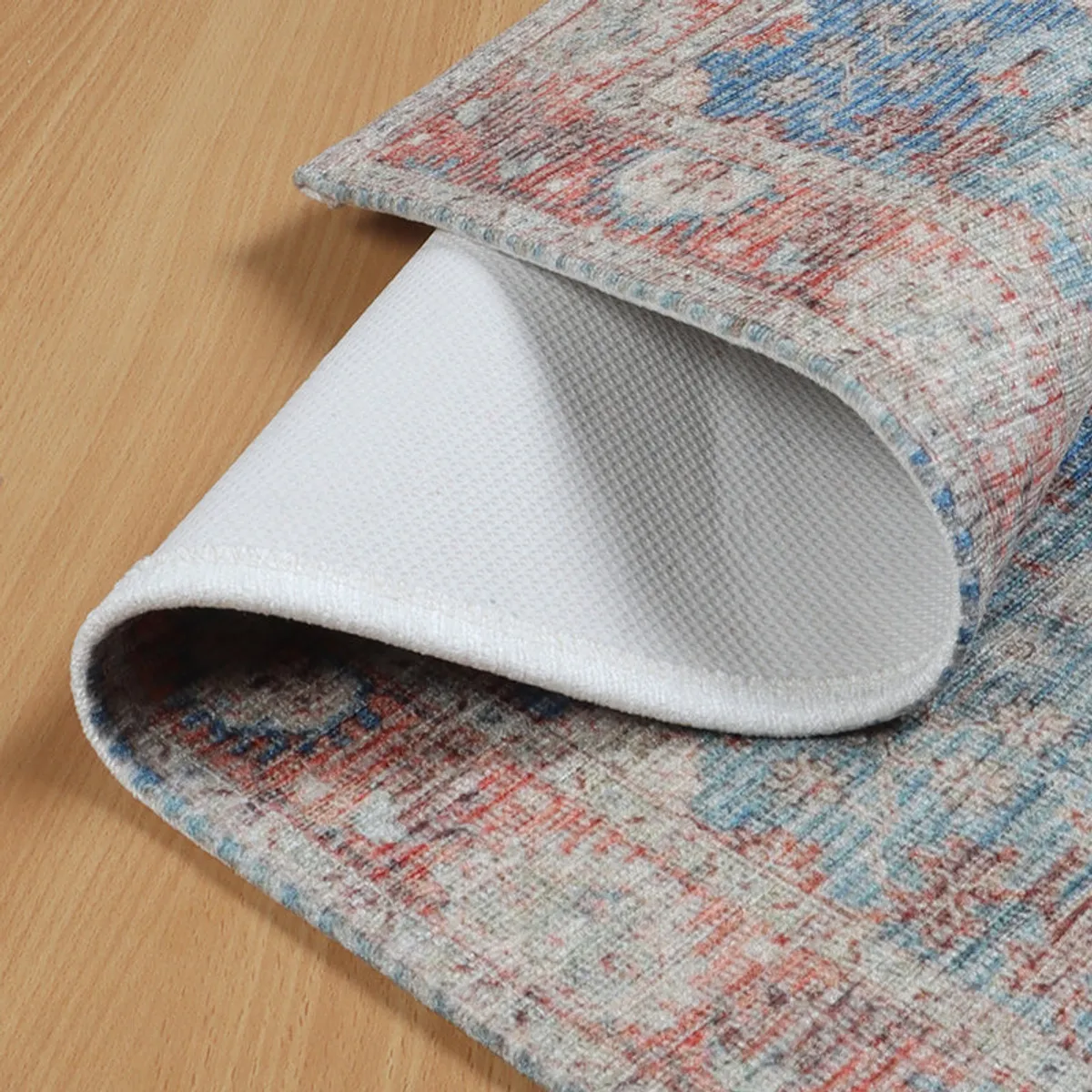 Detailed view of the mat's patterned edge and softly textured surface.