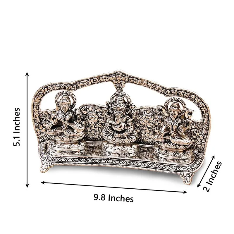 Angled view of the silver-toned Lakshmi Ganesha Saraswati idol