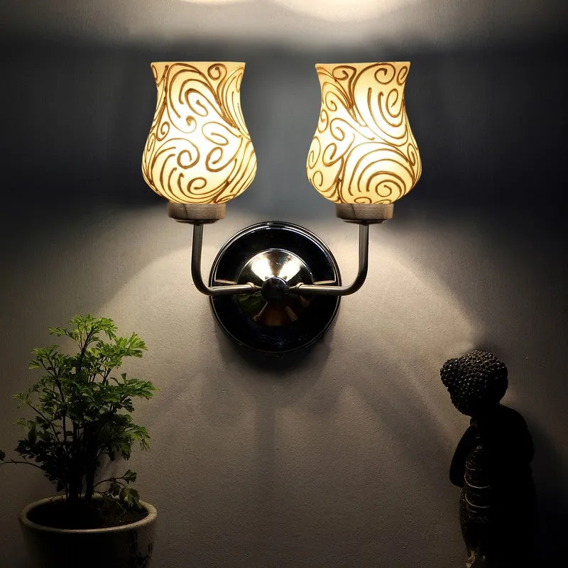 Glowing dual wall lamp casting light upward on a dark wall