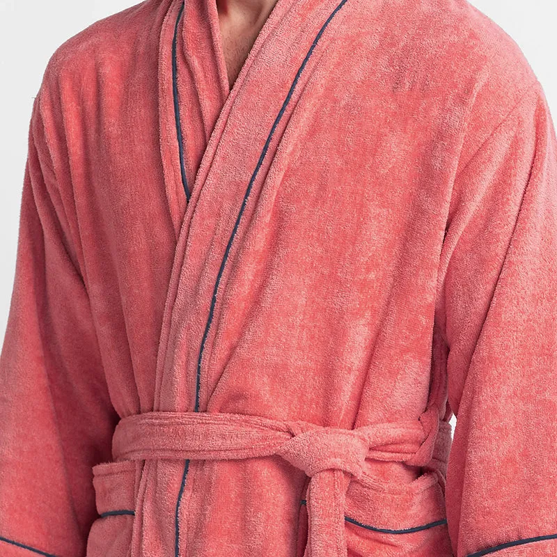 Close-up of peach bath robe fabric and navy piping detail