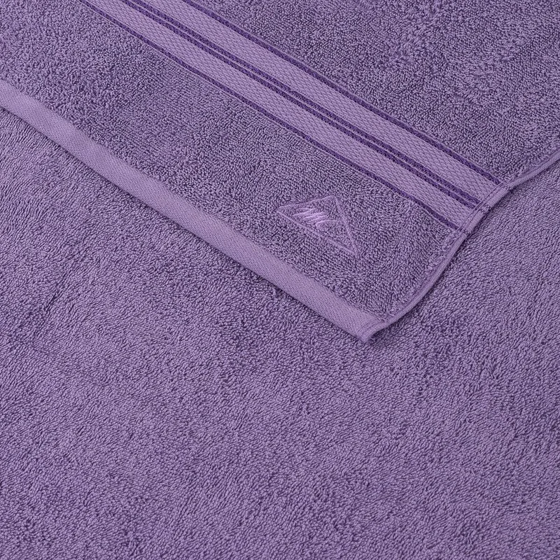 Close-up of purple towel texture and woven border stripes