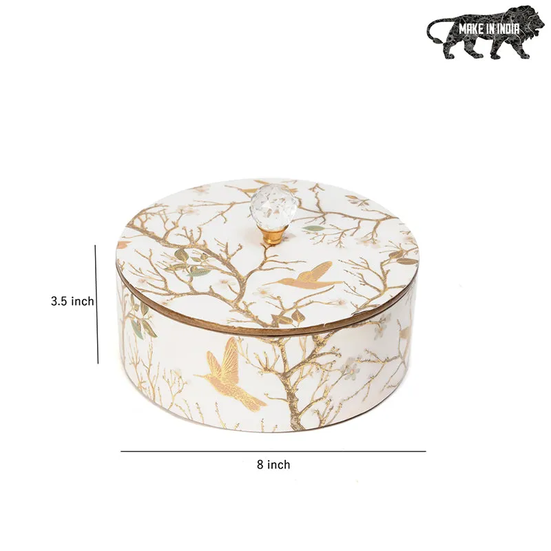 Closed white round box with gold botanical bird design and crystal knob