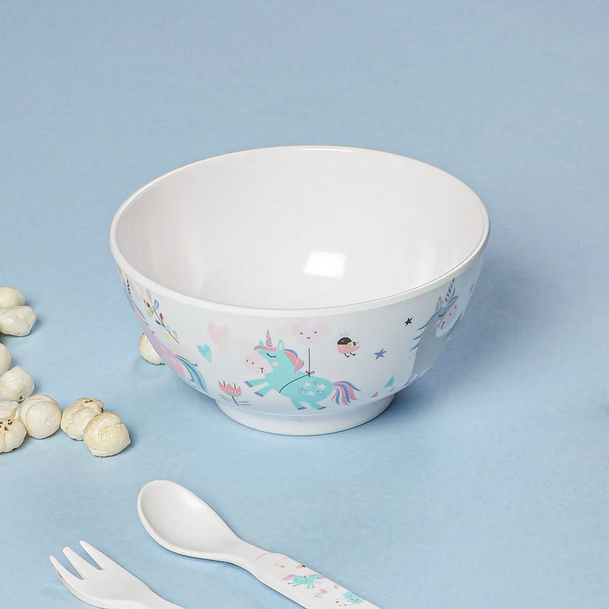 White snack bowl featuring colourful unicorn and star artwork