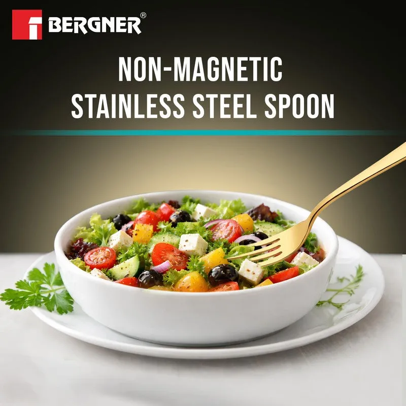 Gold fork shown with a bowl of salad