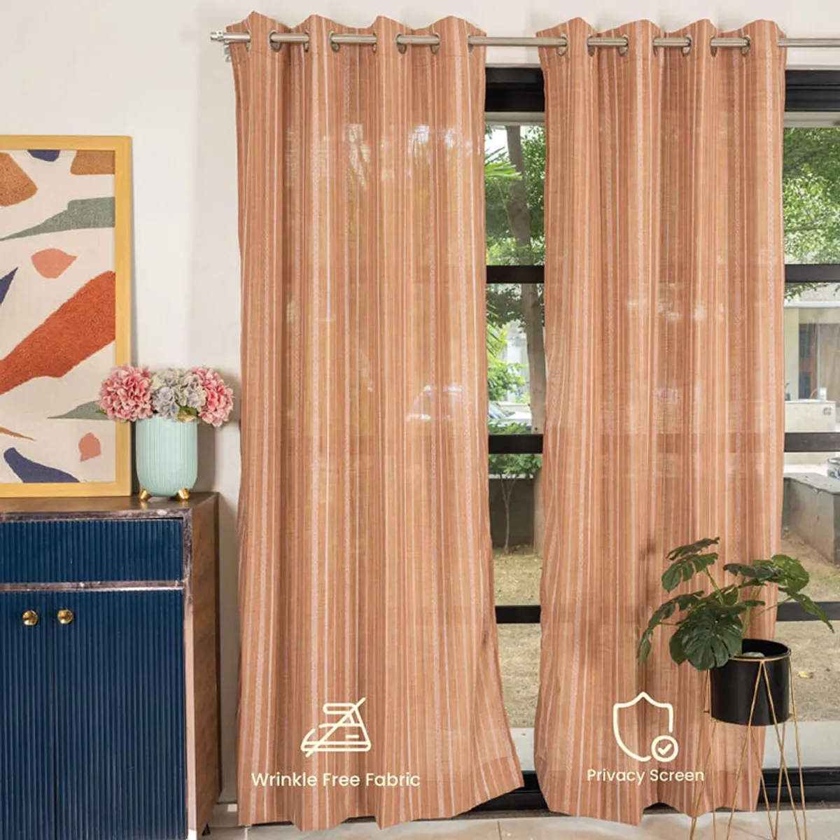 Muddy pink striped curtains filtering daylight in a contemporary room