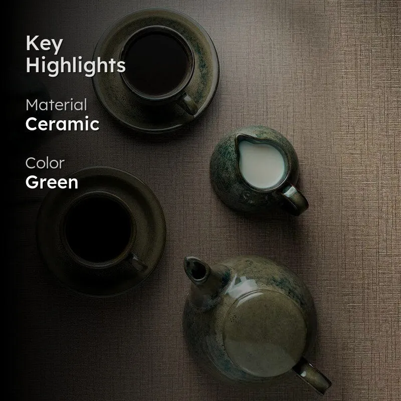 Green ceramic tea set arranged on a textured surface