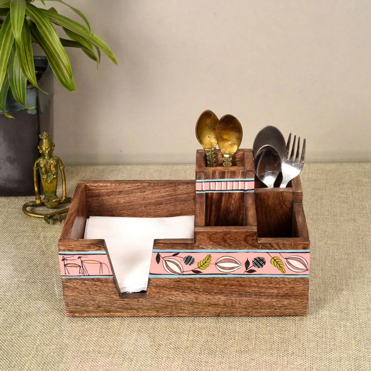 Front view of a brown wooden cutlery holder with decorative pink bands