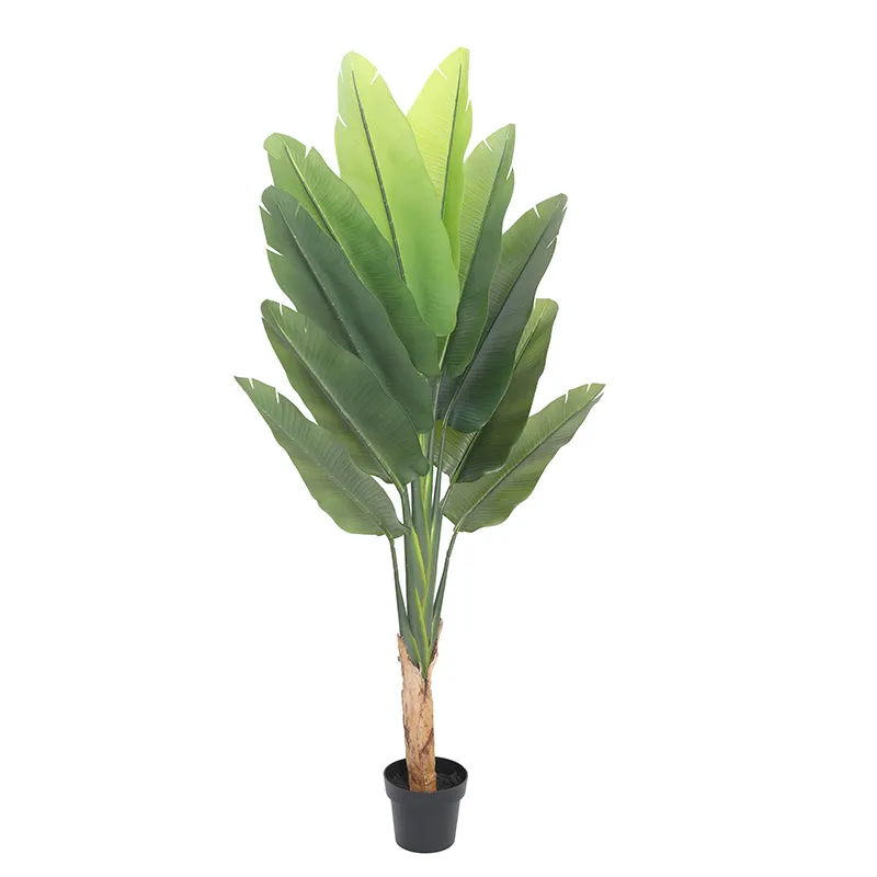 Full view of the tall green artificial plant in its black pot