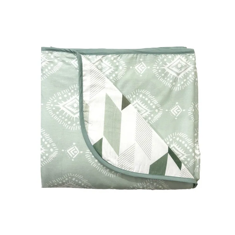 Folded olive green dohar with contrasting reversible printed side visible