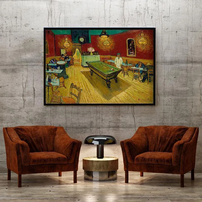 Framed Night Cafe artwork displayed above two brown armchairs and a small table.